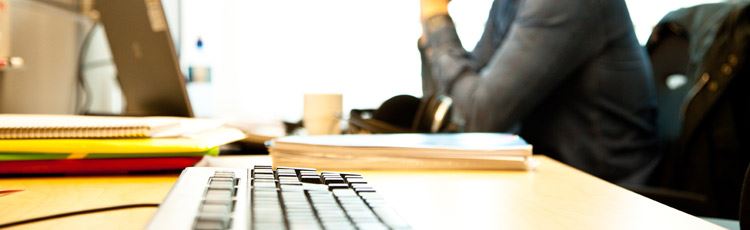 Man sitting in front of a computer. 