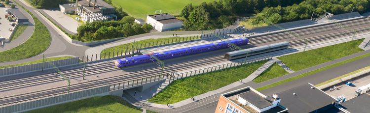 A computer animated picture of a station area. Four tracks and two platforms along the outer tracks. A purple Pågatåg is passing the station.