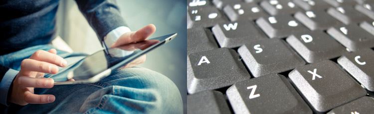 Man holding a tablet. Part of a keyboard. 