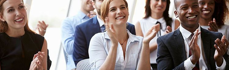 People cheering in a crowd.